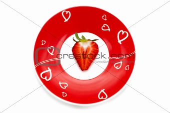 Deliciously half a red strawberry romantic plate