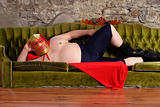 Mexican wrestler lying on a couch