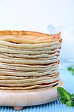 traditional American pancakes on a wooden stand