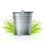 metallic bucket in grass