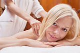 Blond woman having a massage in a spa