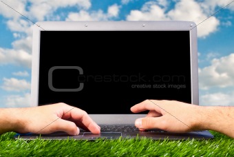hands are working on laptop