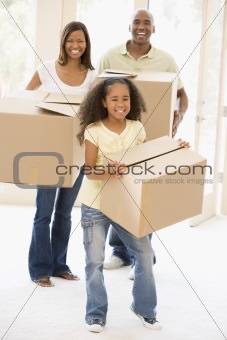 Family moving into new home smiling