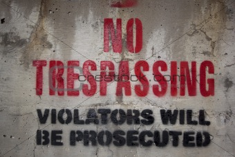 No trespassing on a cement wall