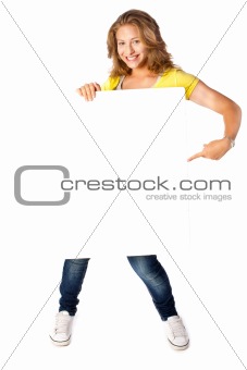 Happy young woman holding a blank billboard