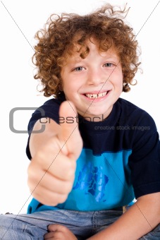 Casual young kid showing thumbs up