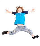 Attractive young kid jumping high, indoors