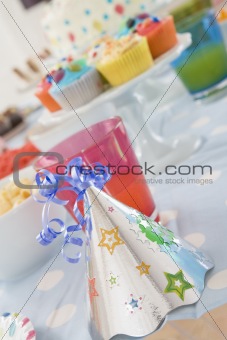 Birthday party table setting with food