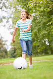 Young girl playing soccer