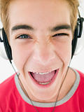 Teenage boy wearing headphones and smiling