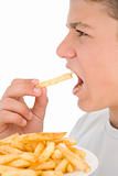 Boy eating French fries
