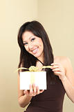 Woman Holding a Wrapped Gift Package
