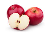 Two ripe red apples and half of apple