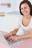 Portrait of a smiling woman with a laptop