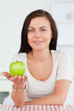 Cute woman showing an apple