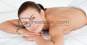 Close up of a woman lying on a massage table