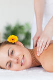 Portrait of a beautiful woman having a shoulder massage