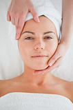 Portrait of a cute woman enjoying a facial massage
