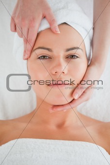 Portrait of a cute woman enjoying a facial massage