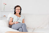 Charming woman listening to music