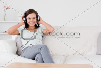 Beautiful brunette listening to music