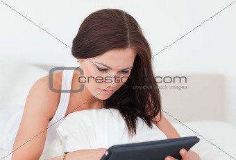 Close up of a young woman with a tablet