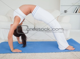 Athletic young woman practicing yoga