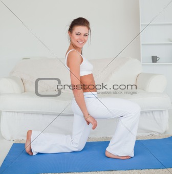 Fit brunette practicing yoga