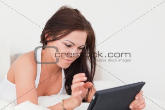 Young brunette with a tablet