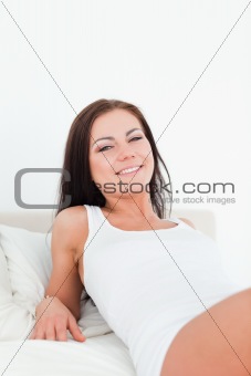 Close up of a smiling  brunette posing