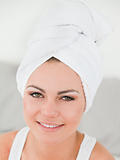 Close up of a woman with the hair wrapped into a towel