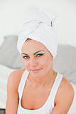 Portrait of a woman with the hair wrapped into a towel