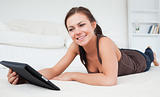 Smiling woman playing with her tablet