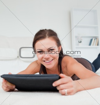 Cute woman working on her tablet
