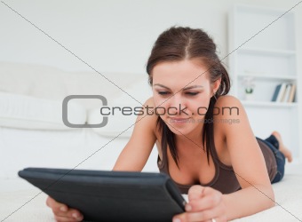 Young woman working on her tablet