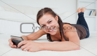 Smiling young woman texting