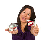Multiethnic Woman Holding Small For Sale Real Estate Sign and House in Hand Isolated on White Background.