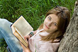 Teenages girl reading book