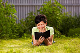 reading e-book in the park