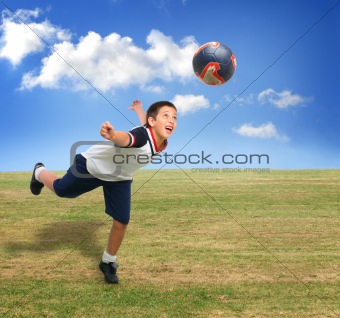 Kid playing soccer outside