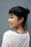 Attractive young Korean woman with her head turned