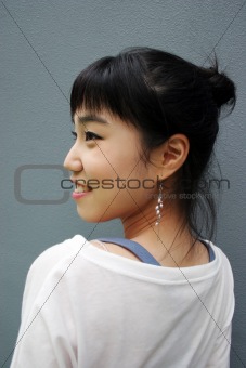 Attractive young Korean woman with her head turned