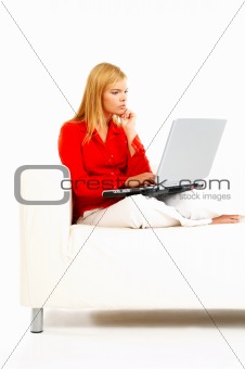 Women with laptop on couch