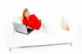 Women with laptop on couch