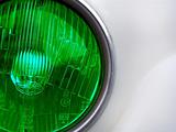 Green classic car headlight