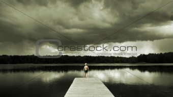 Boy standing on a Footbridge 