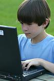 Boy Typing on Laptop