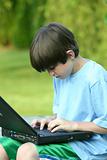 Boy Working on Laptop