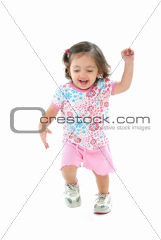 Little girl smiling and dancing