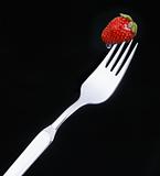 Delicious strawberry on a fork